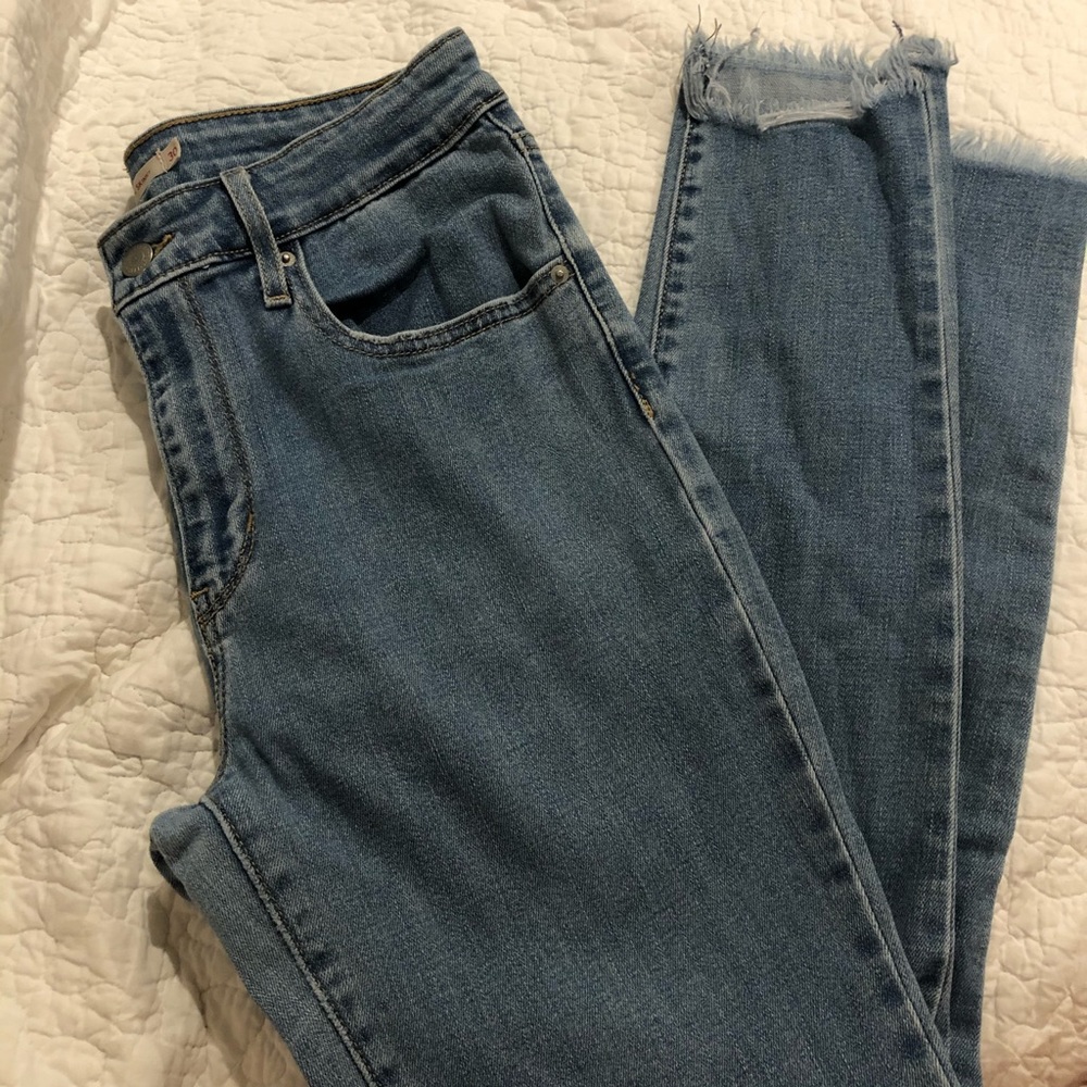 Levi’s skinny jeans in light wash with chewed hem